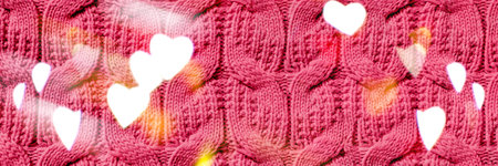 Beautiful handmade knitted repeating pattern. Festive bokeh background in the form of hearts for...