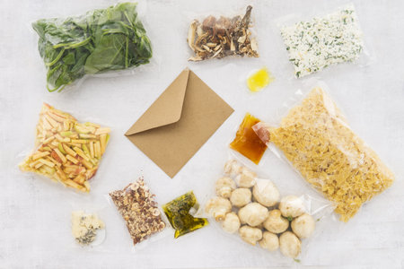 Set of products for Italian dinner: pasta, spinach, mushrooms, apples, nuts, olive oil, sauces and...