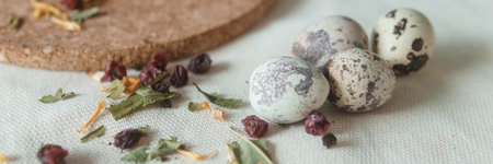 Easter cupcakes with raisins and quail eggs on a white table close-up. The concept of celebrating...