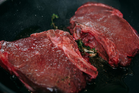 Raw beef meat for cooking steak. Raw beef is sliced, cooking meat for cooking steak in a cooking class.の写真素材