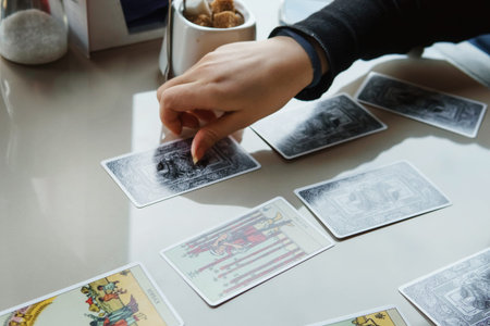 TVER, RUSSIA - FEBRUARY 11, 2023. Tarot cards, Tarot card divination, esoteric background. A woman...