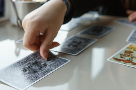 TVER, RUSSIA - FEBRUARY 11, 2023. Tarot cards, Tarot card divination, esoteric background. A woman...