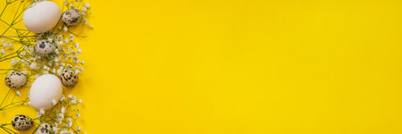 Easter background, various eggs on a yellow background, decorated with natural botanical elements, flat lay, view from above, empty space for textの写真素材