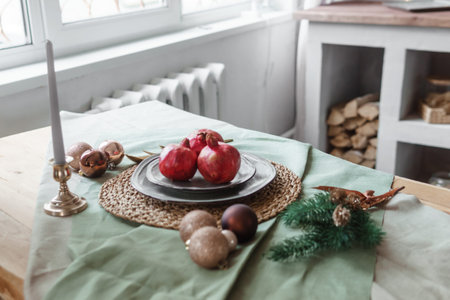 Serving a festive Christmas table in Scandinavian style. Decor on the table before the holiday.