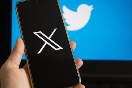 July 25, 2023, Russia. The logo in the form of the letter X displayed on the smartphone. Twitter...
