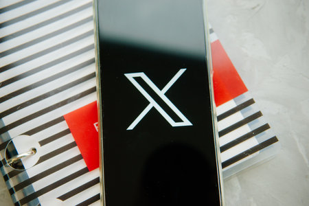 July 25, 2023, Russia. The logo in the form of the letter X displayed on the smartphone. Twitter rebranding, and implementation of X.のeditorial素材