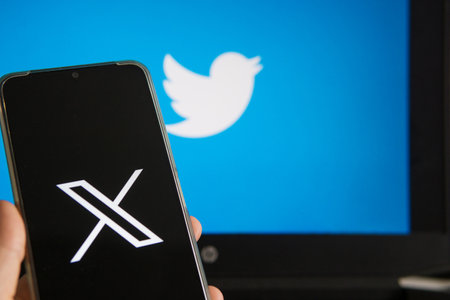 July 25, 2023, Russia. The logo in the form of the letter X displayed on the smartphone. Twitter rebranding, and implementation of X.のeditorial素材