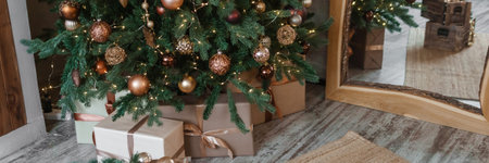 Bronze balls on the Christmas tree close-up. Christmas tree design decorations. The concept of celebrating New Year and Christmas.の写真素材