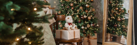 Home New Years interior. Christmas tree with gifts, decorated with garlands in the kitchen. Cozy atmosphere of a home holiday, loft design of the room, Scandinavian style.の写真素材