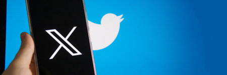 July 25, 2023, Russia. The logo in the form of the letter X displayed on the smartphone. Twitter rebranding, and implementation of X.のeditorial素材