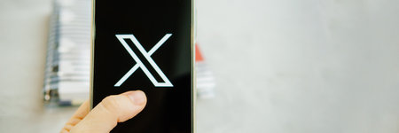 July 25, 2023, Russia. The logo in the form of the letter X displayed on the smartphone. Twitter rebranding, and implementation of X.のeditorial素材