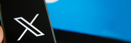 July 25, 2023, Russia. The logo in the form of the letter X displayed on the smartphone. Twitter rebranding, and implementation of X.のeditorial素材