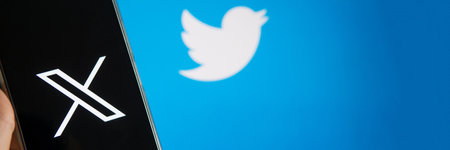 July 25, 2023, Russia. The logo in the form of the letter X displayed on the smartphone. Twitter rebranding, and implementation of X.のeditorial素材