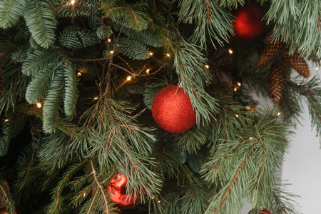 Christmas trees decorated with red balloons in front of the cafe entrance. Street Christmas decorations.の写真素材