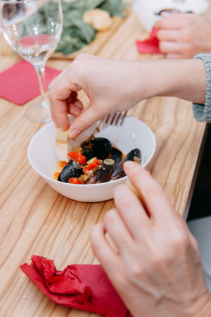 Tomato soup with mussels. The process of cooking tomato soup from mussels in a cooking class. Home-made food.の写真素材
