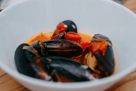Tomato soup with mussels. The process of cooking tomato soup from mussels in a cooking class....
