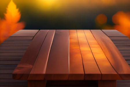 Empty wooden table in nature outdoor for free space for product, natural template with beauty bokeh and sunlight, beautiful autumn concept with nature outdoorの写真素材