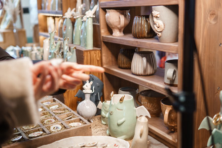 Sale of handmade ceramic Christmas tree toys at the Christmas Fair. Black Friday for the winter holidays.の写真素材