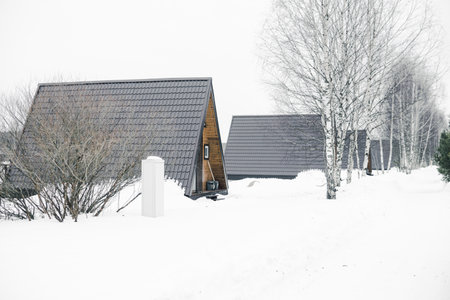 A country house in nature in winter. Rest in an ecologically clean place in winter. Glamping in natureの写真素材