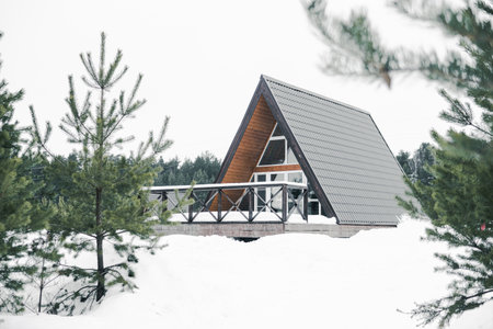 A country house in nature in winter. Rest in an ecologically clean place in winter. Glamping in nature.の写真素材