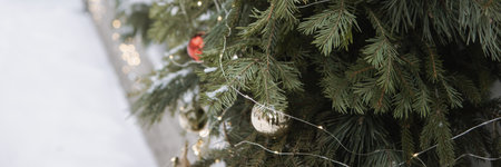 Christmas trees decorated with red balloons in front of the cafe entrance. Street New Year decorations.の写真素材