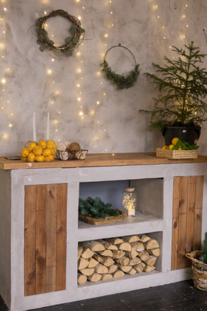 The interior of the Scandinavian-style living room, decorated for the Christmas holidays. Kitchen cupboard in a private house.の写真素材