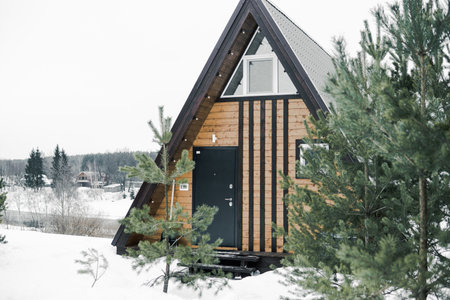 A country house in nature in winter. Rest in an ecologically clean place in winter. Glamping in nature.の写真素材