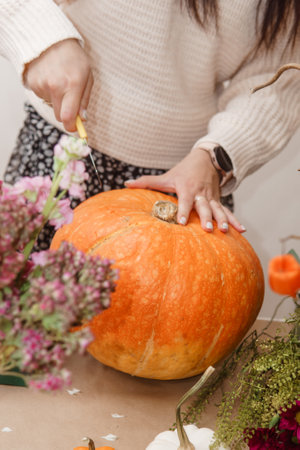 Creating a floral composition in a pumpkin. Making decor with your own hands.の写真素材