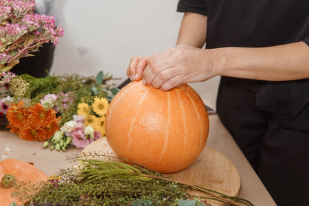 Creating a floral composition in a pumpkin. Making decor with your own hands.の写真素材