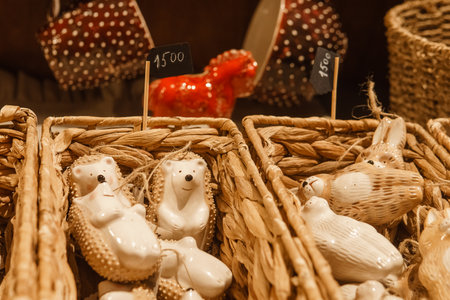 Sale of handmade ceramic Christmas tree toys at the Christmas Fair. Black Friday for the winter holidaysの写真素材