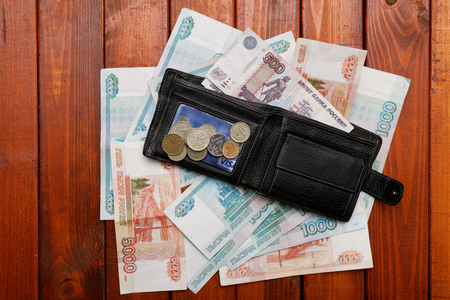 Wallet and money on wood backgroundの写真素材