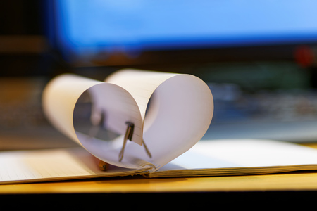 Valentines heart of a folded sheet of notebook defocusedの写真素材