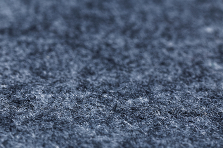 Closeup artificial grey felt background. Angle view. Shallow focus.の写真素材