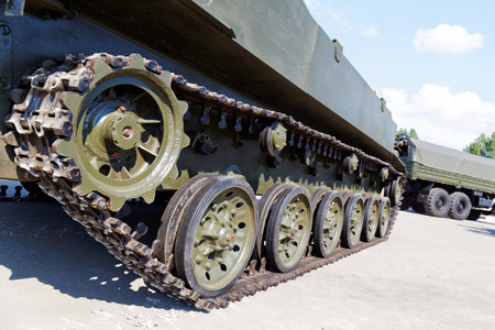 Closeup tracks and wheels of the army tank