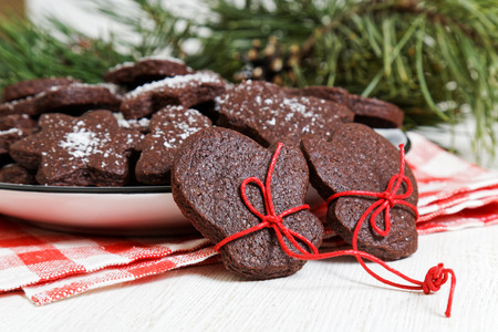 Closeup homemade Christmas chocolate cookies on white wooden table. SHallow focus.の写真素材