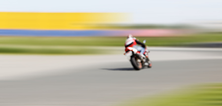 Abstract blurred background with copyspace. Blur motion of motorcycle racer on a track.の写真素材