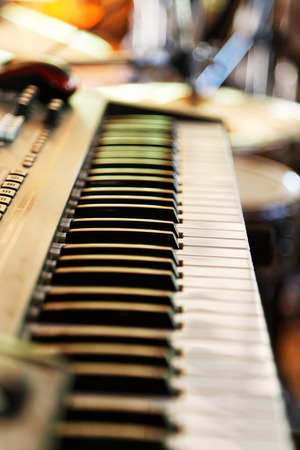 Keyboard of music electronic synthesizer, piano on blurred background. Shallow focus.の写真素材