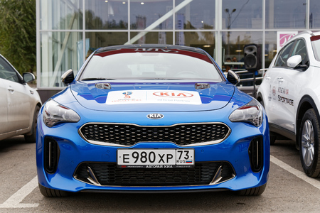 Ulyanovsk, Russia - October 06, 2018: New KIA Stinger - exhibition car stands in front of the building of KIA MOTORS car selling and service center.のeditorial素材