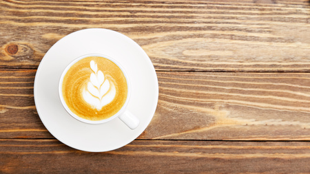 White cups of coffee cappuccino on wooden background. Top view with copyspace.の写真素材