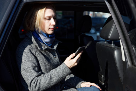 Portrait of Woman who Using Smartphone in Car