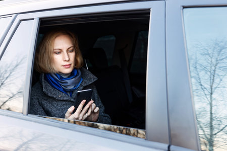 Portrait of Woman who Using Smartphone in Car
