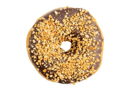 Closeup chocolate covered donut and sprinkled with grated nuts isolated on white. Top view.の写真素材