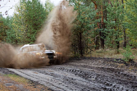 Ulyanovsk, Russia - September 25, 2021. Rally raid "Hills of Russia". Rally car on a dirt road through the forest.のeditorial素材