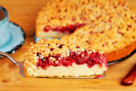 Closeup piece of homemade raspberries pie with streisel. Shallow focus.の写真素材