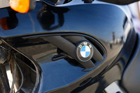 Ulyanovsk, Russia - August 24, 2024. Closeup fragment of motorcycle with BMW logo.のeditorial素材