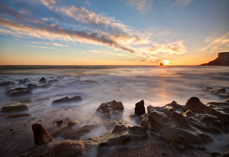Sunrise over Saltwick Bay, Whitby, North Yorkshireの写真素材