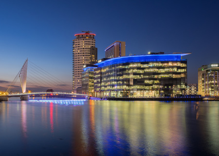 Manchester, UK - February 14, 2015: Salford Quays, Manchester. Night view of the BBC and ITV studio complex at Media City, Salford.のeditorial素材