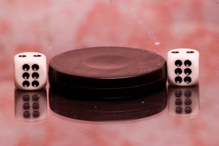 checkers and dice for the game on the boardの写真素材