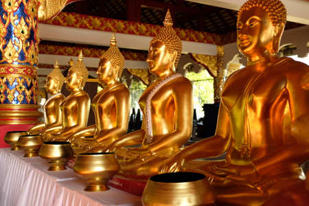 Chiang Mai Thailand - Temple Suan Dok golden Buddha statues with alms bowlのeditorial素材