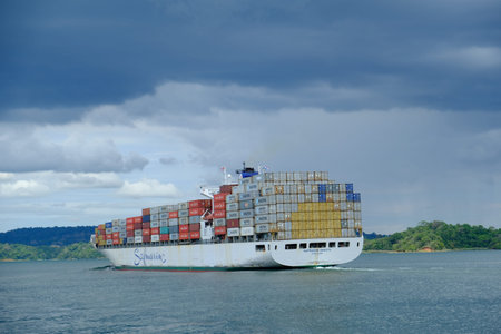 Panama Canal - Canal de Panama - Container ship passing through the canal